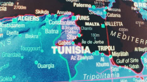 close-up of an illuminated map showing north africa and the mediterranean sea