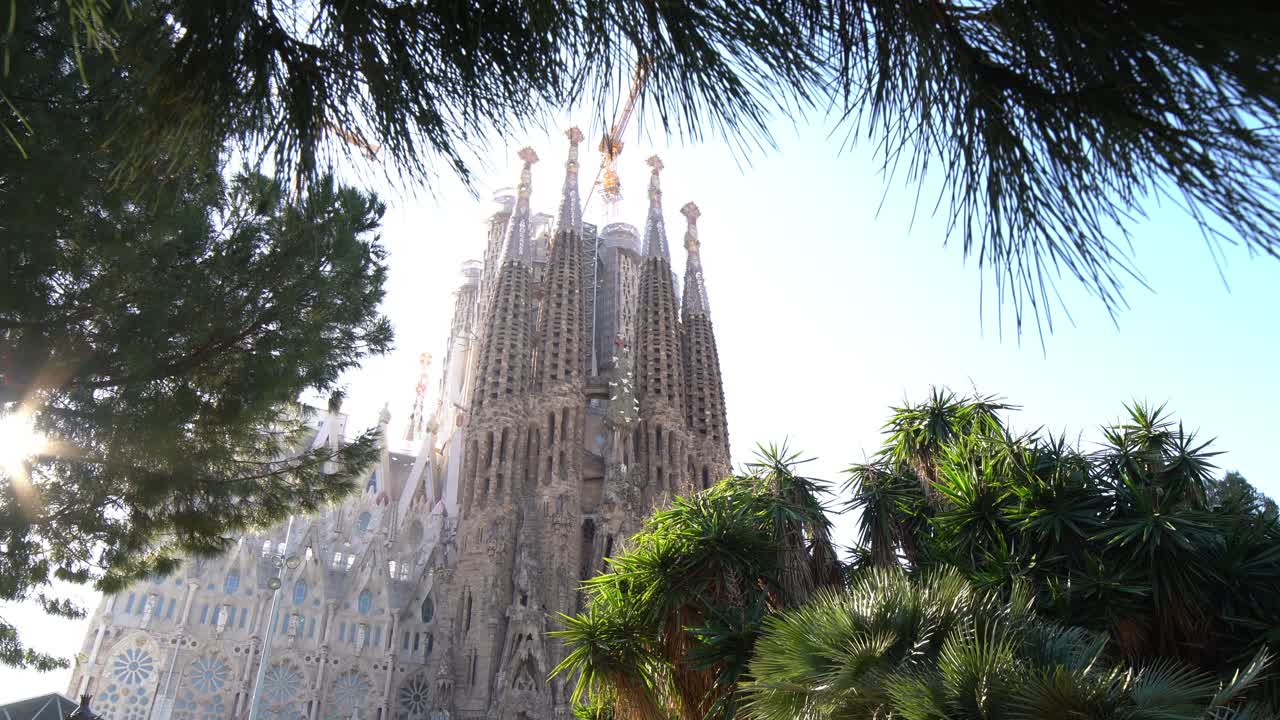 Slight dolly forward of La Sagrada Familia from the park opposite, Barcelona