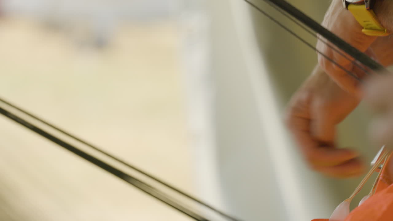 Close-up of a person's hands folding a parachute