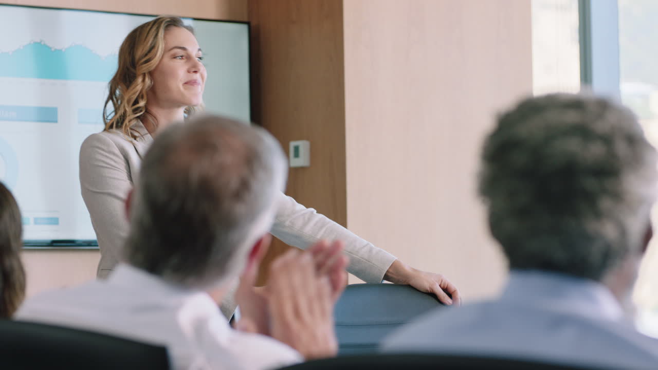 beautiful business woman team leader presenting financial data on tv screen sharing project with shareholders briefing colleagues discussing ideas in office boardroom presentation