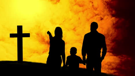 animación de una silueta de la cruz cristiana y una familia con un niño sobre nubes amarillas moviéndose