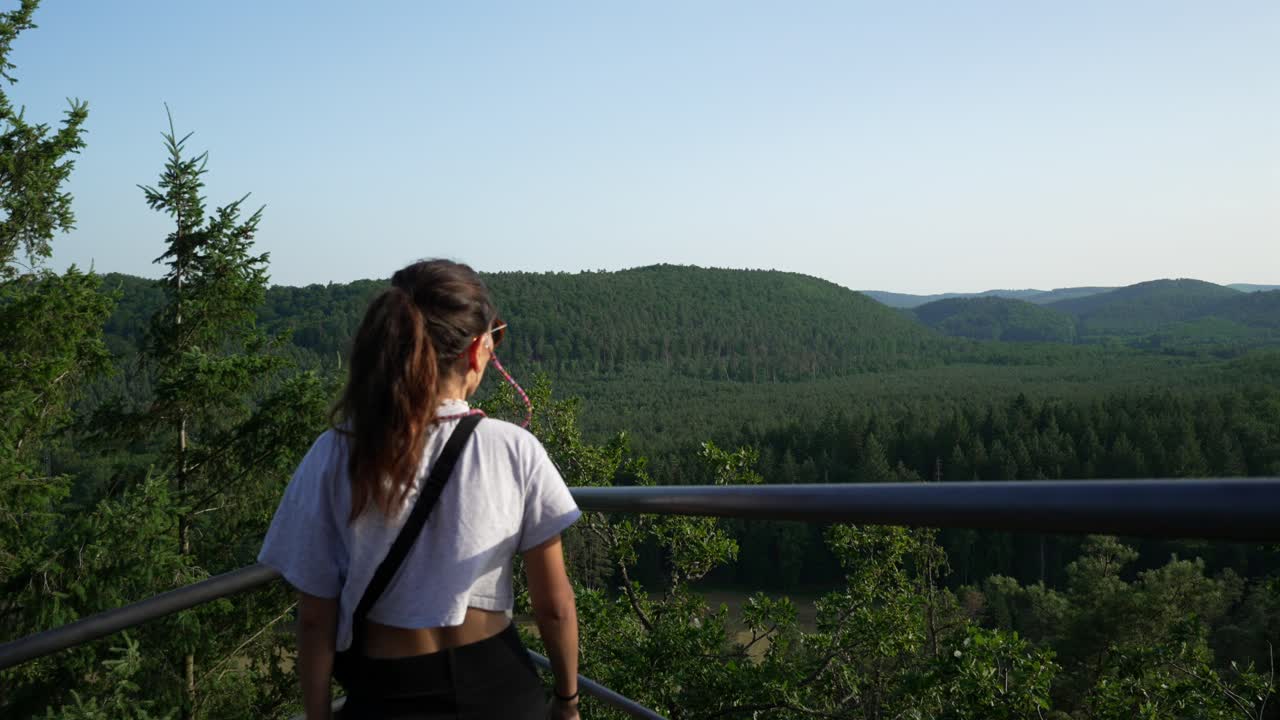 Young woman tourist lookout platform North Vosges Regional Natural Reserve France