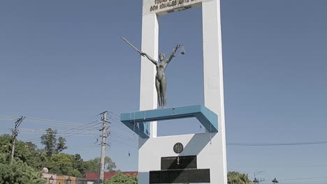 A-tilt-up-shot-of-the-Monumento-a-La-Constitución-in-San-Salvador-during-a-sunny-day-from-the-base-of-the-monument