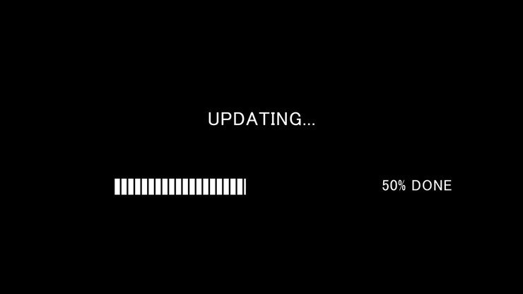 Video of loading progress bar with on-screen text updating on black background