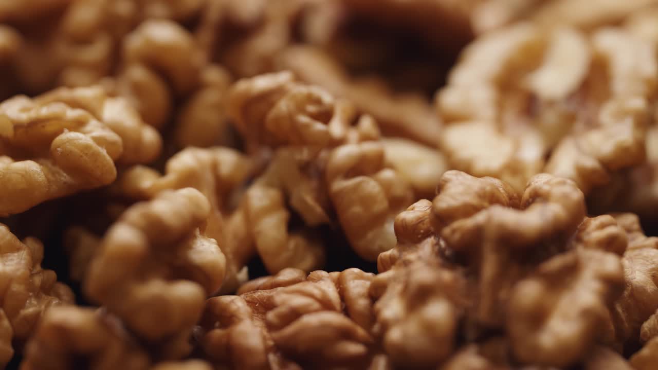 Smooth Camera Movement Over a Handful Walnuts.