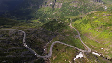 road trip through mountains and hills towards geirangerfjord in geiranger region in norway, aerial view