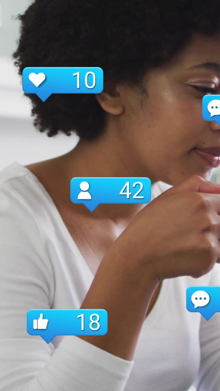 Animation of social media icons over african american women drinking coffee