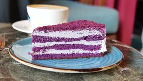 purple cake slice with coffee