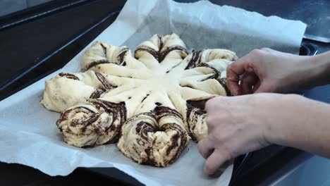 making festive star-shaped cake: polish traditional poppy seed roll