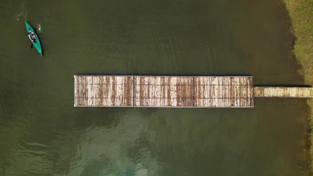 Canoe arriving to a dock at Cundinamarca, Colombia