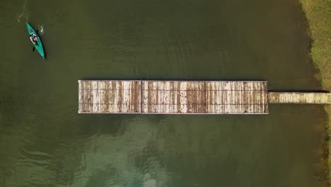 canoe arriving to a dock at cundinamarca, colombia