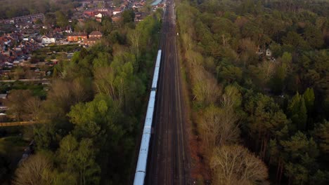 aerial view train travelling through english countryside on sunny day