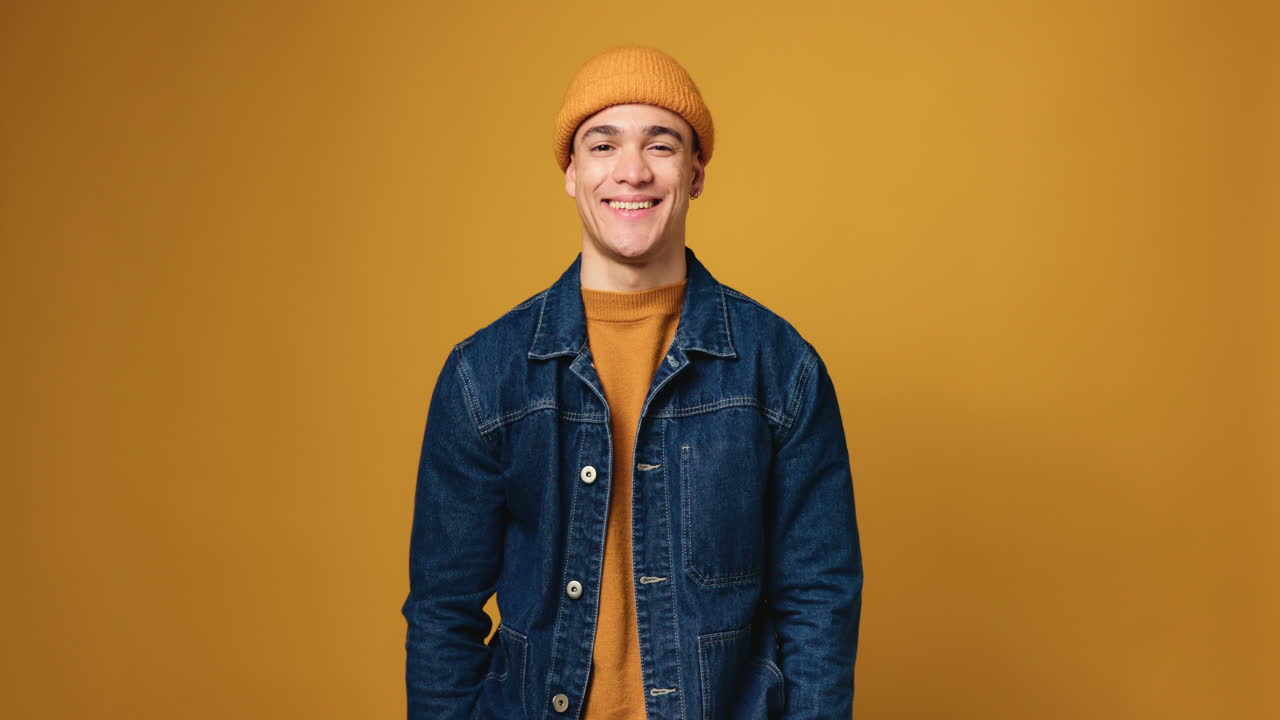 Man wearing beanie and denim jacket