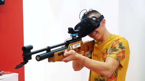 person playing vr shooting game