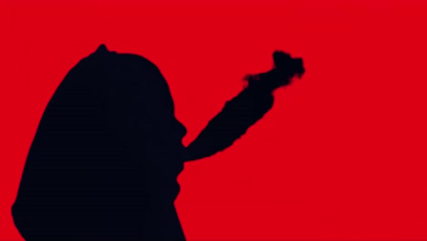 silhouette of a person with a hood
