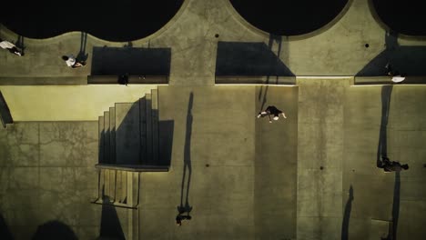 Overhead-view-of-Venice-Skate-Park-at-sunset-with-long-shadows-of-skaters