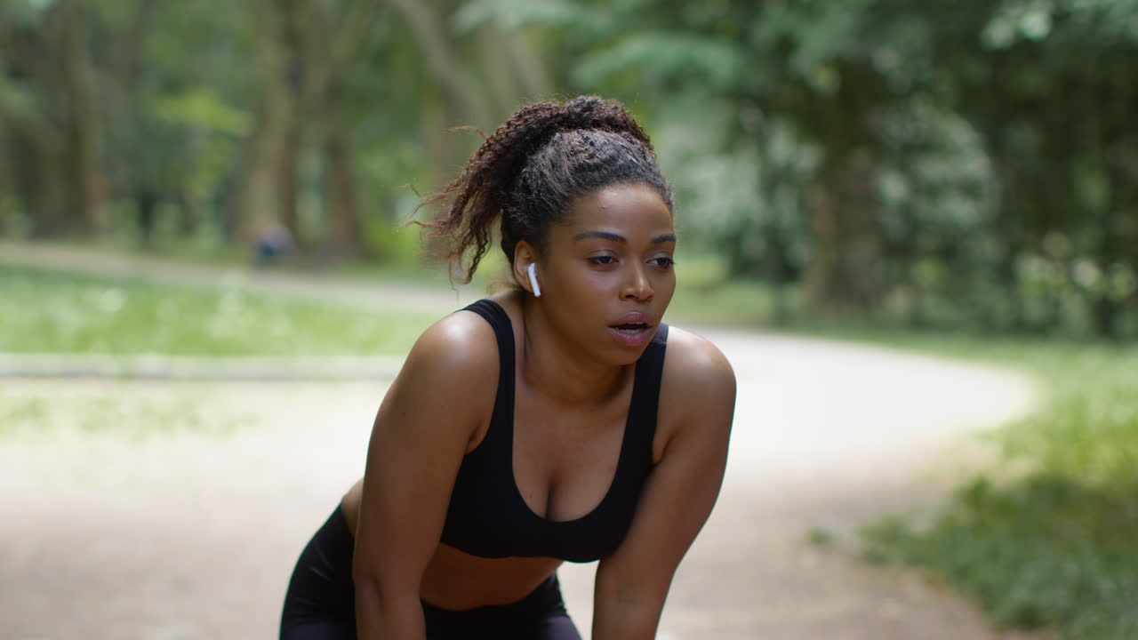 Woman resting after a workout in the park