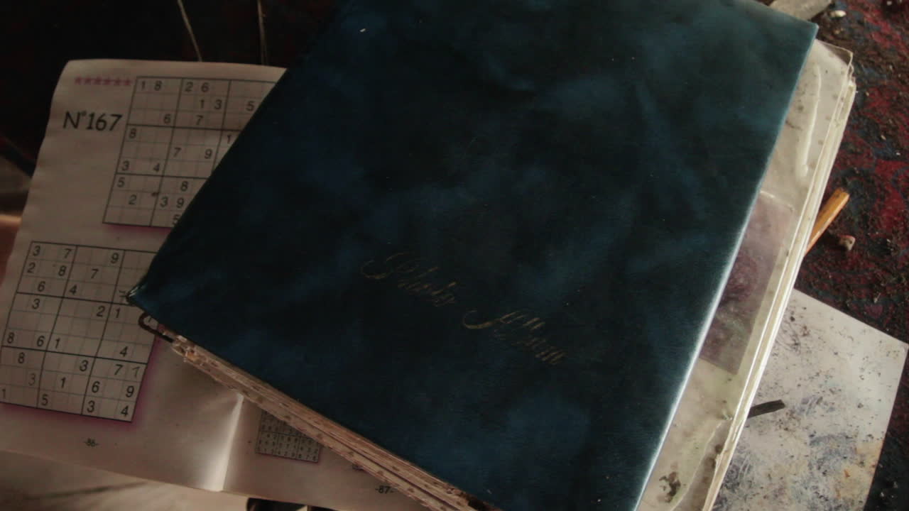 Sudoku and an old album found in a rural hut at the Darien Gap in Colombia.