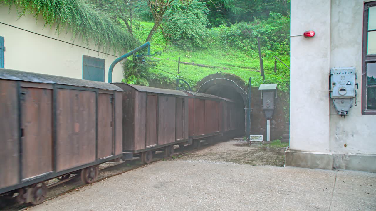 Train entering the Glancnik tunnel and taking tourists for the mine tour in the Moring district, Crna na koroskem, Slovenia