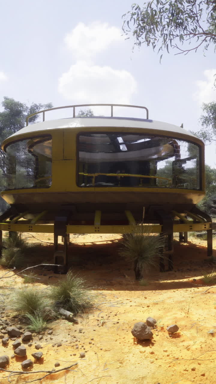 Unique circular structure surrounded by dry vegetation in a remote area