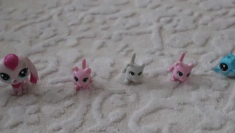 cute standing littlest pet shop figures on carpet - close up