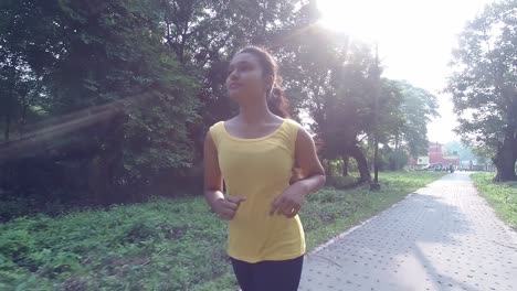 young asian girl running or jogging at morning or evening sunset or sunrise in nature