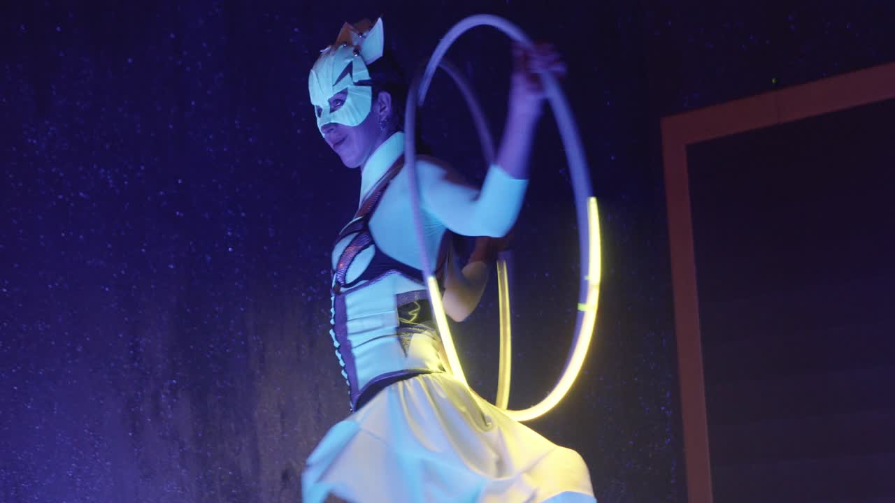 Young woman performing a show with a hoop on a casino.