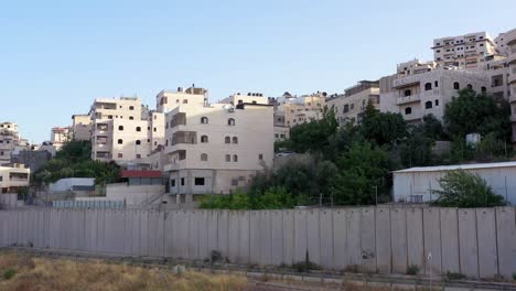 palestine refugges camp behind concrete wall -aerial