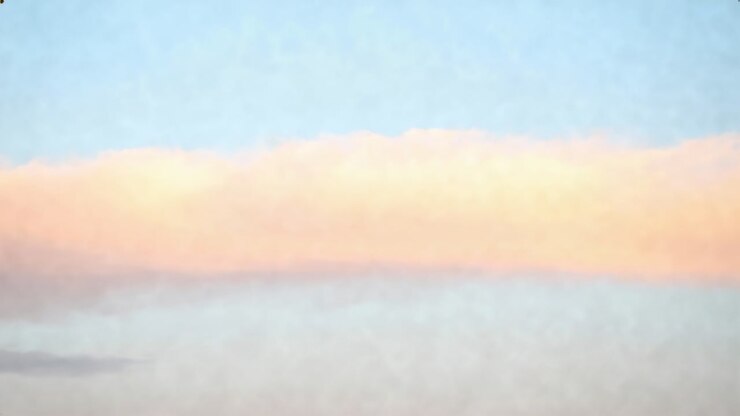 Glowing cloud band reacting to low sun, shifting pink-orange and gray tones at horizon