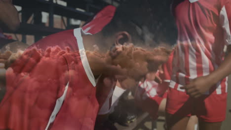 holding heads, soccer players in red jerseys feeling disappointment on field