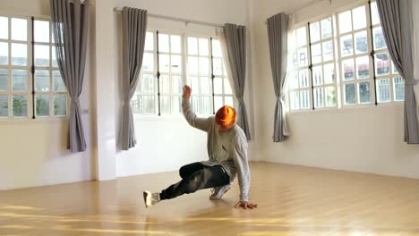 young male breakdancer training, slow motion