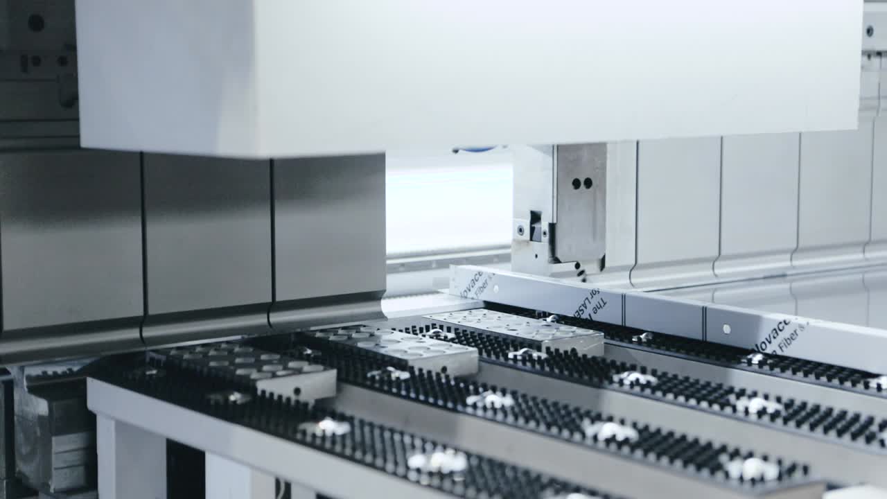 Automatic machine processing sheet metal product in high tech workshop ...