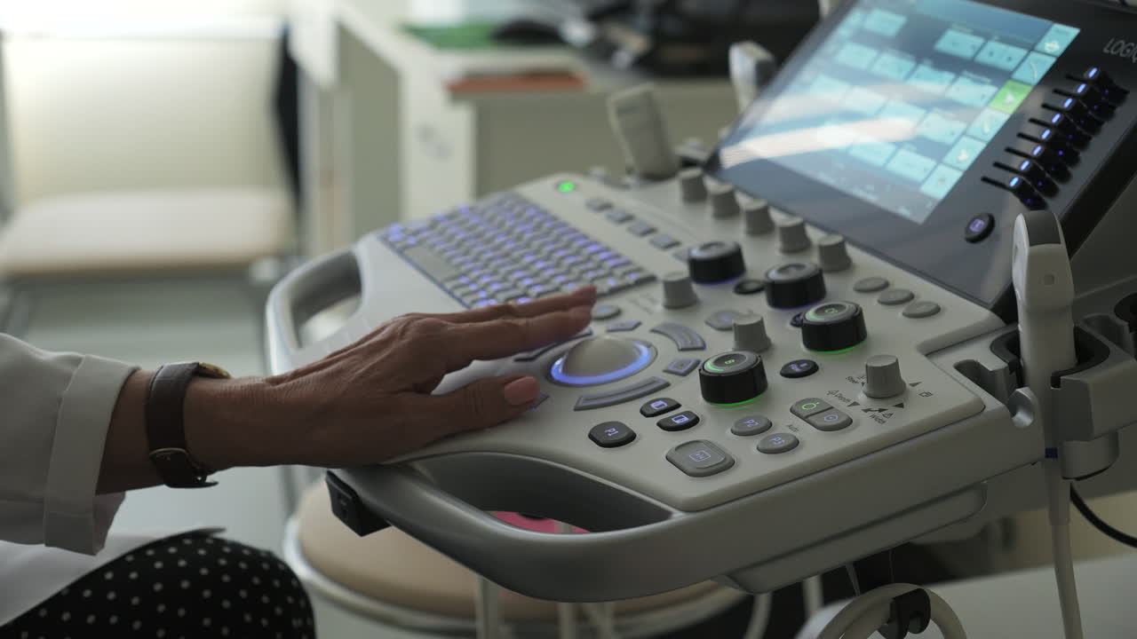 Doctor using ultrasound machine