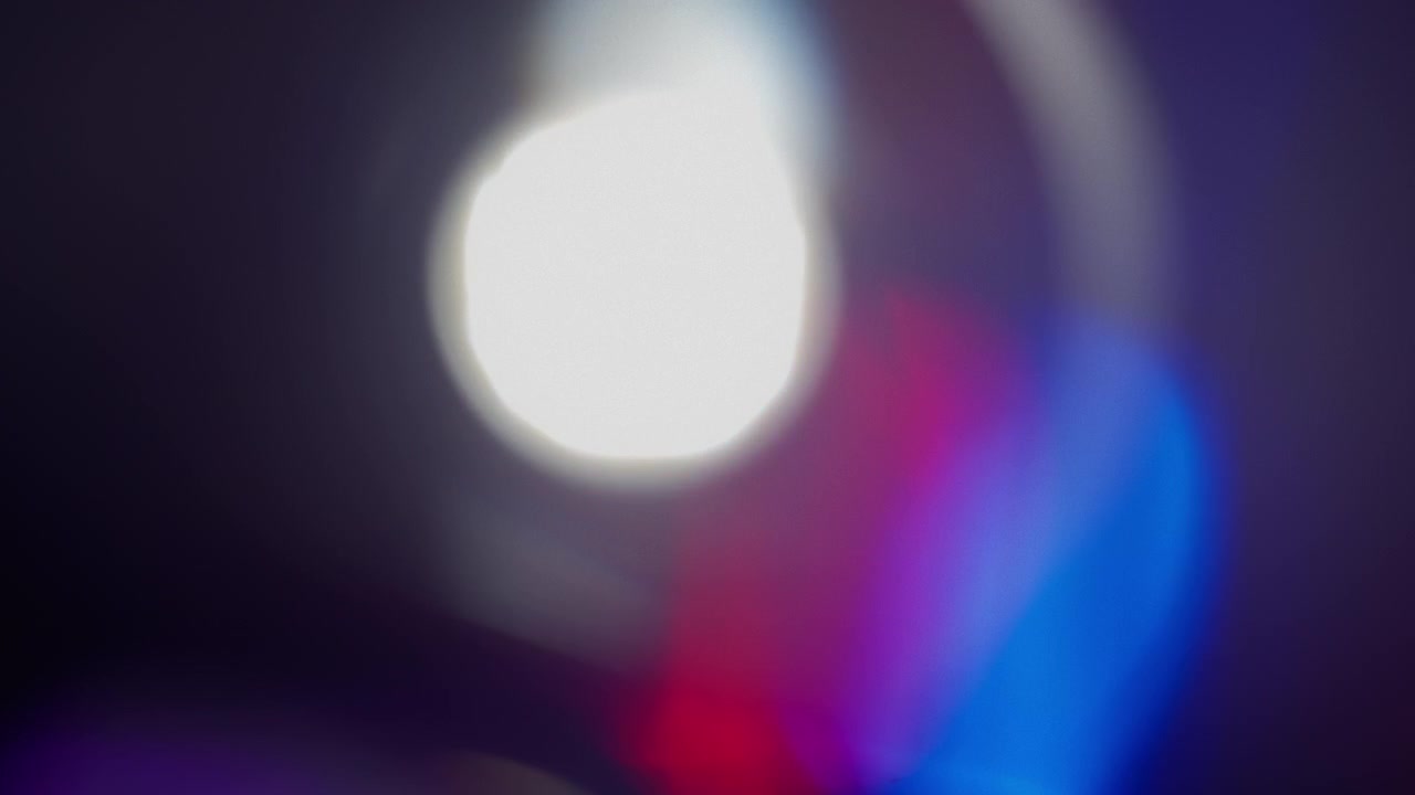 Abstract light leaks created from glass prism reflection with blue and red color
