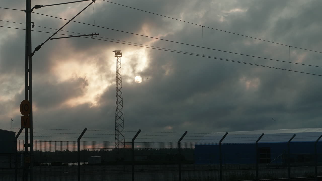 Beautiful Slow Timelapse of Clouds passing in Front of the Sun during Sunset, Industry Zone, Seagulls Flying, Harbor