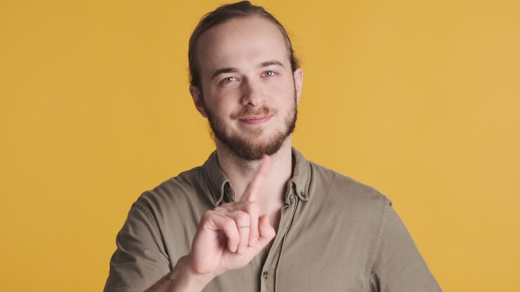 Caucasian young man saying no on camera.