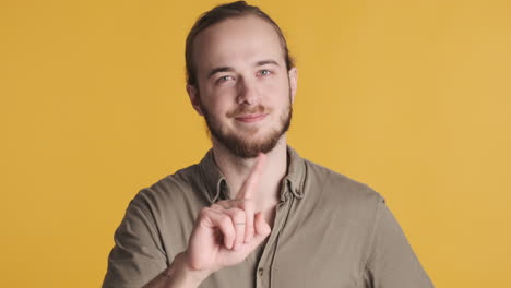 caucasian young man saying no on camera.