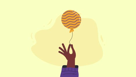 mano con un globo en la mano