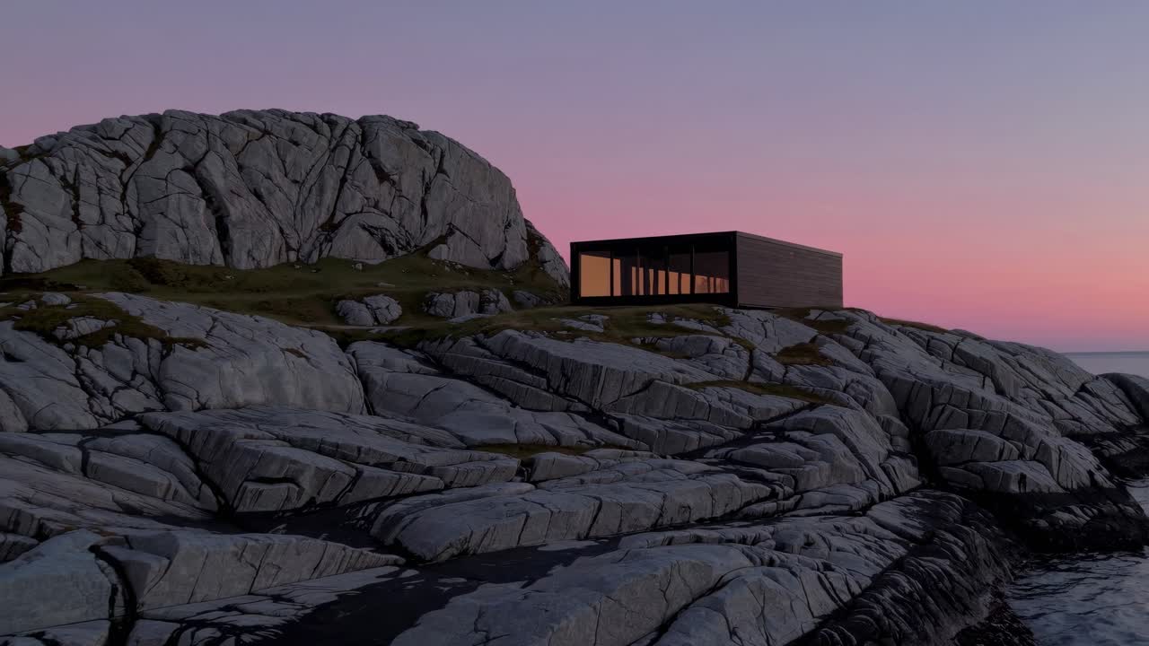 Modern Cabin on Rocky Coast at Sunset