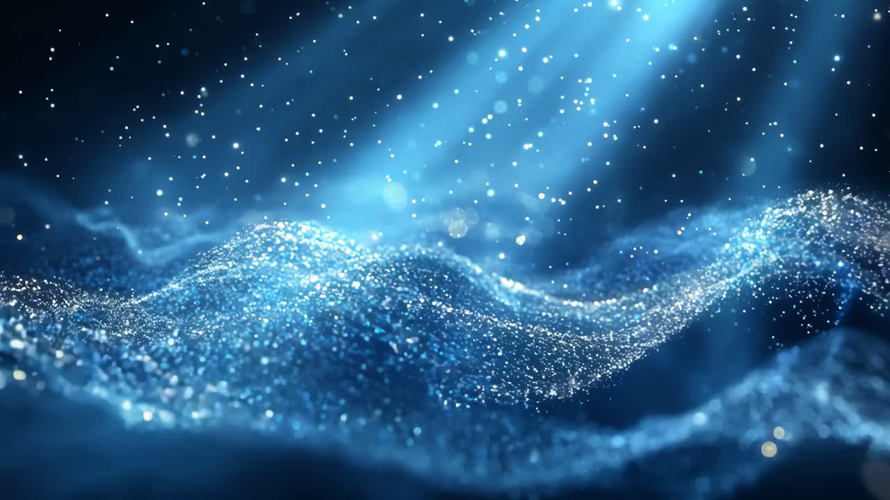 A blue ocean with a lot of glitter in it. The glitter is scattered all over the ocean and it looks like it's shining in the sunlight