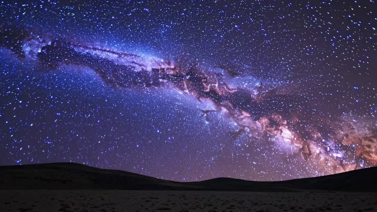 A mesmerizing video still of the Milky Way galaxy captured from a low-angle view