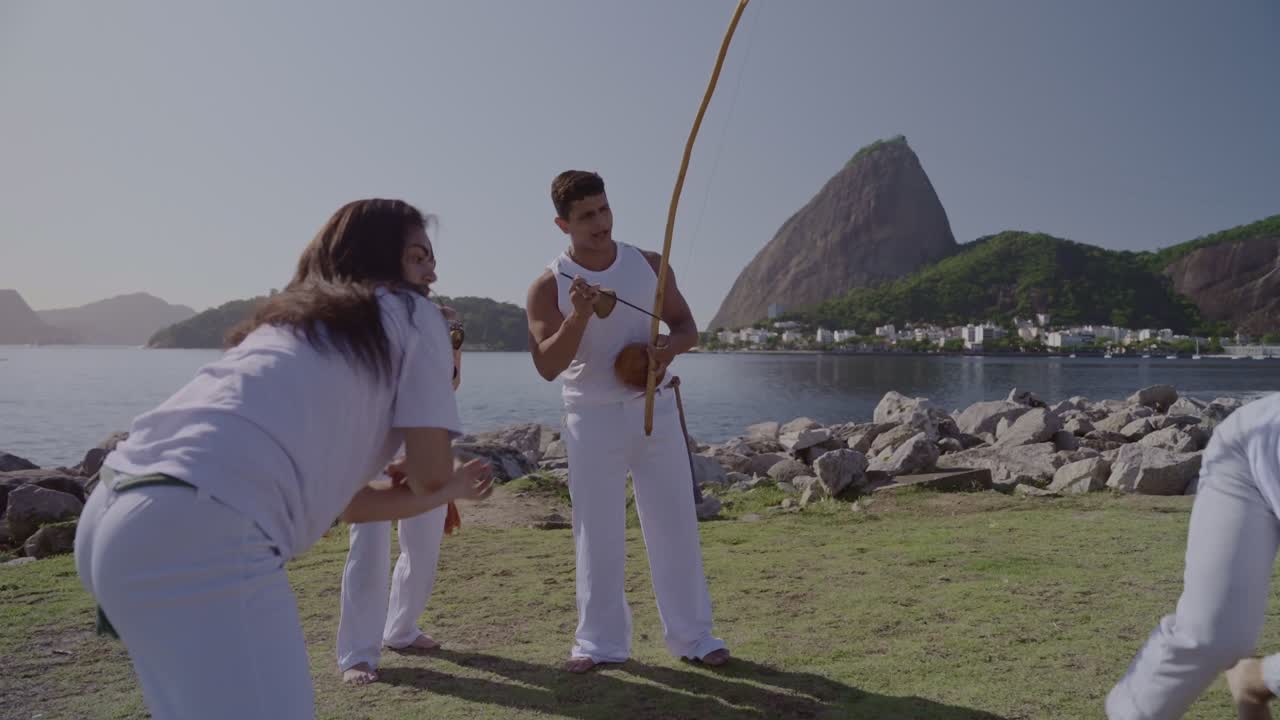 People Practicing Capoeira Outdoors in Rio de Janeiro, Brazil