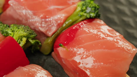 raw salmon skewers with vegetables