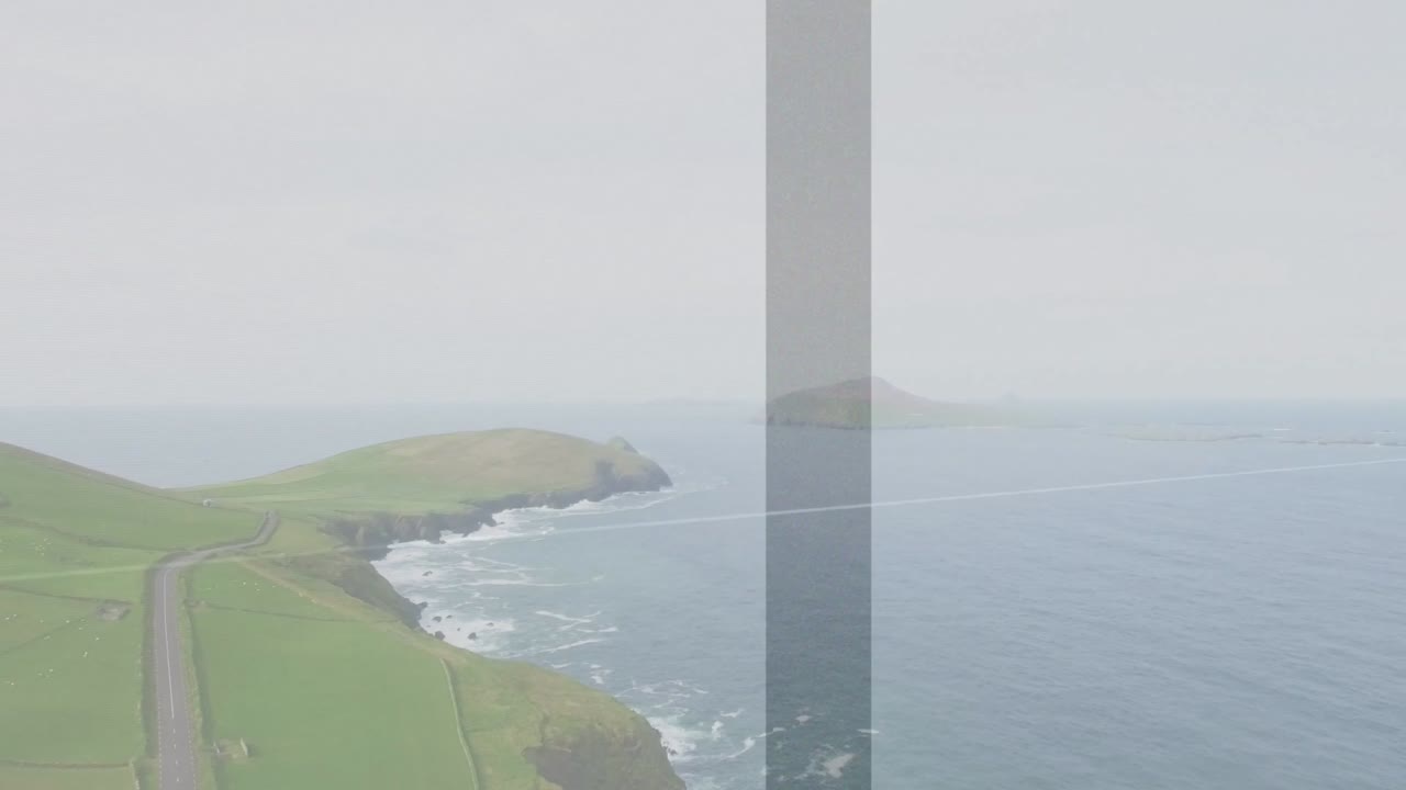 Drone holding view filming coast, framing shifts creating faint bars and contrail across sky
