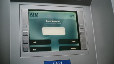 atm user entering pin code on atm keypad for money withdrawal. error message on cash machine screen about cancelled transaction due to connection loss. cash transactions, banking system. close up.
