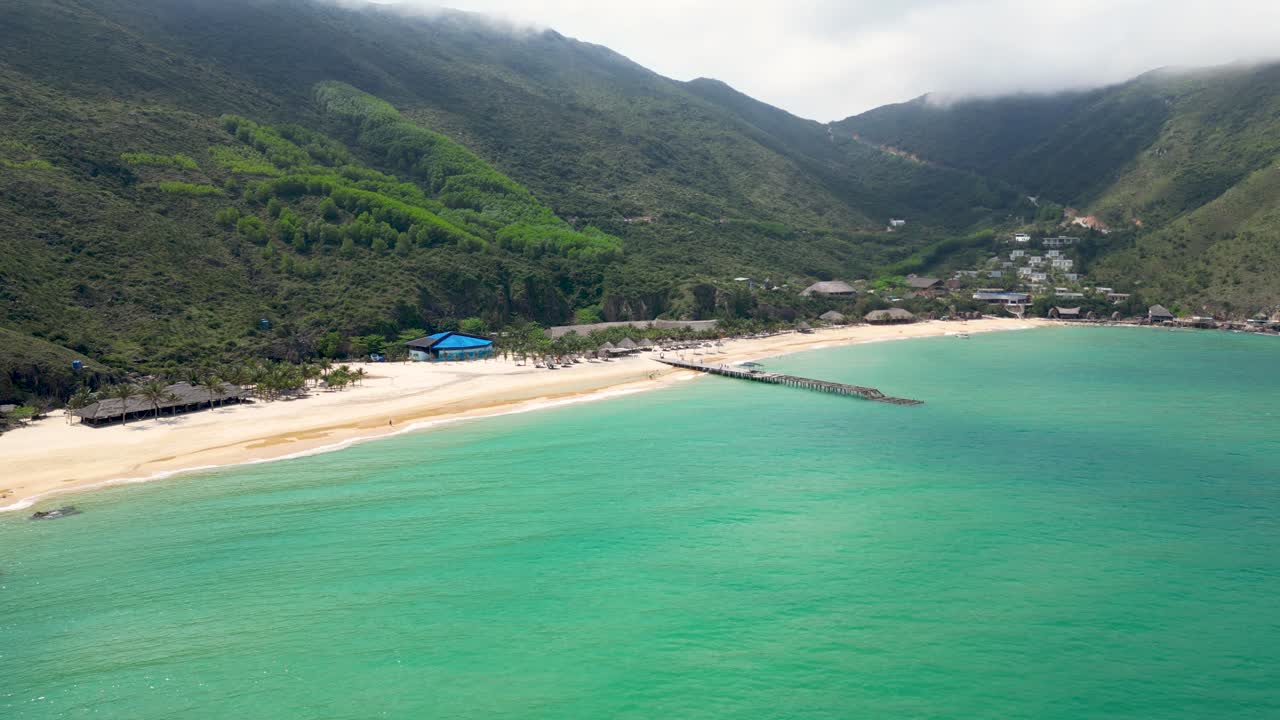 Stunning drone flight over hidden tropical sand beach in Southeast Asia