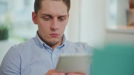 Man-Shops-Online-on-Tablet