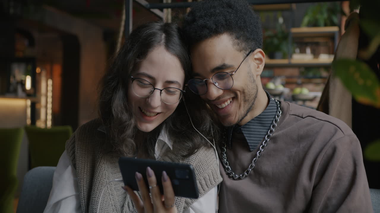 Couple Enjoying a Video Call in a Cafe