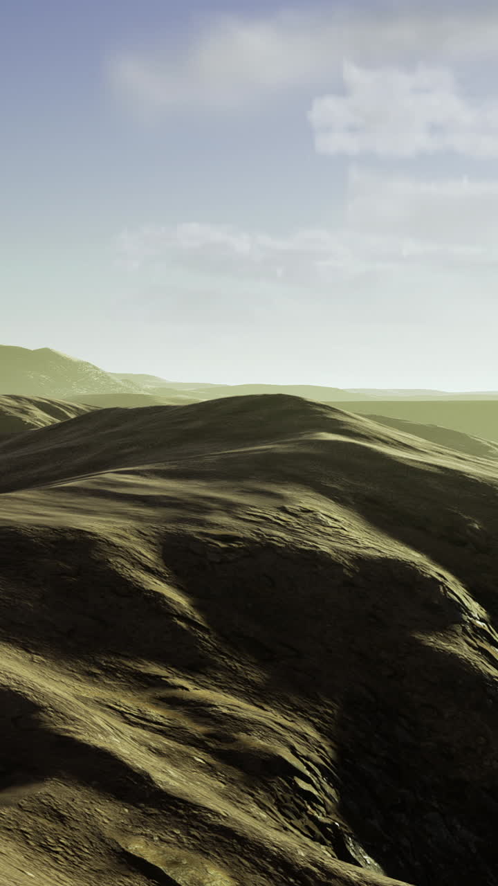 Expansive golden landscape under a bright sky at sunrise