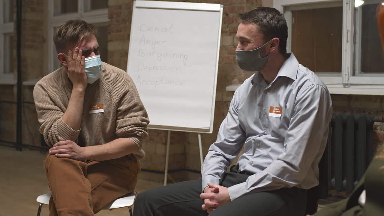 Depressed Men Talking at Group Therapy Session